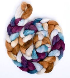 multicolored wool roving on white background with clippings to the top