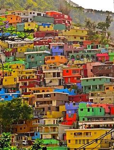 many colorful houses are on the hill side