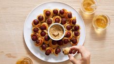 a white plate topped with pigs in a blanket