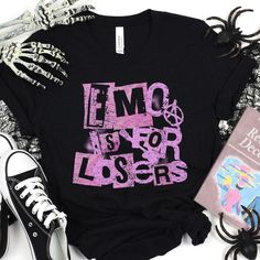 Show off your sense of humor and love for emo music with this funny "Emo Is For Losers" t-shirt. Perfect for alternative music fans who enjoy a playful twist on their style. 🎤🎸 -Bold Graphic Design: Features a humorous "Emo Is For Losers" text with distressed, edgy font. -Perfect for Emo Fans: Ideal for those who appreciate a blend of humor and alternative music culture. -Great Gift Idea: Makes a fun and thoughtful gift for friends or family who love emo music. PLEASE CHECK THE SIZE CHART! We Losers Quote, Loser Quotes, Edgy Fonts, Music Culture, Emo Music, Alternative Music, Quote Tees, Clothes Shopping, Emo Goth