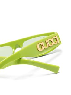 lime green acetate geometric frame green tinted lenses UV-protective lenses logo plaque at the arm straight arms and curved tips These glasses come with a protective case. Lens Logo, Geometric Frame, Gucci Eyewear, Sunglass Frames, Lime Green, Protective Cases, Lenses, Gucci, Sunglasses