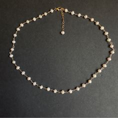 Dainty Freshwater Pearl Beaded Necklace. Materials: 4-5mm Genuine Freshwater Pearls. 14k Gold Filled Wire. 14k Gold Filled Lobster Clasp. Necklace Length From 14 Inches + 2 Inches 14k Gold Filled Extended Chain. * Custom Orders Are Welcome. Every Once In Awhile, You See Things That Bring You Pure Joy. Admire This Necklace And Smile As Others Do The Same When You Wear It. Freshwater Pearls Are Cultured Pearls, Grown In Lakes, Rivers, As Well As Ponds. Most Freshwater Pearls Are White And Resemble Akoya Pearls, But They Also Produce A Variety Of Pastel Shades, Including Pink, Lilac And Peach. Metaphysical Properties Of Pearls Peace Prosperity Feminine Energy Integrity Wisdo Pearl Jewelry Rondelle Shape For Gift, Round Pearl Jewelry Gift, Dainty Single Strand Jewelry For Anniversary, Silver Rondelle Jewelry With Tiny Beads, Pearl White Beaded Sterling Silver Jewelry, Dainty Beaded Pearl Necklace For Gift, Dainty Beaded Pearl White Jewelry, White Gold Jewelry With Pearl Chain And Round Beads, Pearl White Dainty Beaded Chain Jewelry