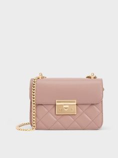 This product is made with at least 20% sustainable materials by weight. CHARLES & KEITH uses recycled, degradable, organic, and water-based materials in our eco-conscious collection. Embrace elegant femininity with this chain-handle bag. The soft blush finish pairs well with the quilted texture for a timelessly luxurious feel. To further enhance that, gold-toned hardware like the push-lock closure and chain-handle straps add eye-catching shine to the classic front-flap design. Whether you are going to work or out to dinner, you can be sure that this bag will effortlessly elevate any ensemble. Charles And Keith Bags, Pink Shoulder Bags, Brand Collaboration, Size Chart For Kids, Charles Keith, Printables Kids, Ankle Straps, Handle Bag, Going To Work