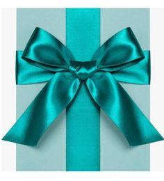 a blue gift box with a large bow