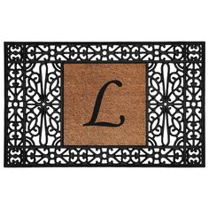 a door mat with the letter l on it and an ornamental design in black ink