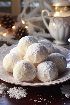 a white plate topped with snow covered donuts