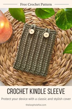 the crochet kindle sleeve is sitting on top of a basket next to an apple