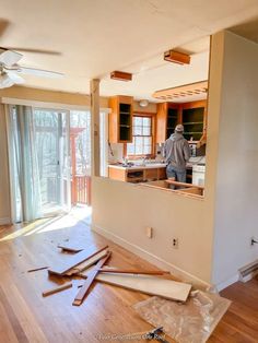 a man is standing in the middle of an unfinished room