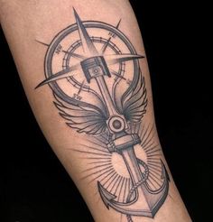 a black and white photo of a compass with wings on the arm, done by person