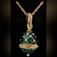 From The World Renowned Romanov Gifts Co, We Bring You The Last Available Stock Of The Iconic Brand. Imperial Empress Egg Necklace, In Beautiful Emerald Green. The Necklace Is Cast Of Bronze, With 22k Yellow Gold-Plated Accents. Set With Austrian Crystal Gemstones, This Pendant Features A Translucent Enameling Of Emerald Green. The Chain Is 18 Inches In Length. The Egg Pendant Measures Approximately 1 In. Height. The Chain Has An Authentic Hallmark “Faberge” Tag, With The Initials “I.F.” Engrave Ornate Jeweled Pendant Jewelry, Green Pendant Costume Jewelry, Faberge Egg Ring, Egg Necklace, Faberge Egg Necklace, Faberge Jewelry, Faberge Eggs Imperial Russia, Arrow Pendant, Wood Bead Necklace