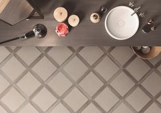 an overhead view of a bathroom sink, toilet and other items on the counter top