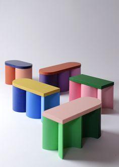 three colorful stools sitting next to each other