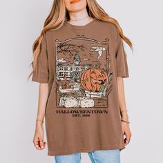 Comfort colors vintage Halloweentown tee. Brown T-shirt For Fall Streetwear, Vintage Graphic Print T-shirt For Fall, Retro Brown T-shirt For Fall, Retro Fall T-shirt With Screen Print, Retro Crew Neck T-shirt For Fall, Brown Graphic Print T-shirt For Fall, Grunge Style Screen Print T-shirt For Fall, Grunge Screen Print T-shirt For Fall, Spooky Short Sleeve T-shirt For Fall