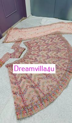 Fabric :  ⏭️ Faux georgette lehenga with paper mirror , zari & thread work  *Flair 3.25 meter* *CAN CAN attach* ⏭️ Faux georgette blouse with paper mirror , zari & thread work all over front & back ( unstitch ) *Tassel border given for blouse waist & sleeves* ⏭️ Faux georgette with paper mirror , thread & zari work  *Weight : 1.550 KG* Multicolor Saree With Gota Work For Reception, Multicolor Floor-length Lehenga With Gota Work, Pink Sequined Georgette Sets, Multicolor Georgette Sharara With Mirror Work, Multicolor Mirror Work Sharara In Georgette, Festive Multicolor Georgette Lehenga, Multicolor Mirror Work Georgette Sharara, Party Lehenga With Mirror Work In Multicolor, Party Lehenga With Multicolor Mirror Work