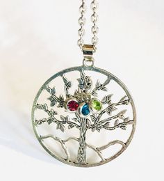 "Tree of life necklace can be personalized with your birthstone or your kids or grandchildren. The silver or Gold necklace will also make a great gift to Mom on Mother's Day or her Birthday and Grandma too. You may also purchase the Tree of Life without a Birthstone, It is lovely by itself and will receive lots of compliments. The Gold tree is a different design so please see the picture  This Silver 1.5 inch Tree of Life Pendant hangs on  a lovely 24\" chain.  The gold chain is 16\" with an extender to measure 20\" This Necklace is so Beautiful and will make your outfit shine. I always get compliments when I wear mine.   : ) This stunning pendant comes with a  Sterling Sliver  Chain that compliments it perfectly. This looks good with a casual outfit all the way up to a nice little semi-fo Adjustable Birthstone Necklace For Keepsake, Spiritual Style Birthstone Necklaces As Gift For Mom, Personalized Spiritual Birthstone Necklace As Gift, Personalized Spiritual Birthstone Necklace For Gift, Nickel-free Necklace For May Birthstone Gift, Nickel-free May Birthstone Necklace As Gift, Nickel-free Necklaces For May Birthstone Gifts, Nickel-free May Birthstone Necklace, Adjustable Nickel Free Birthstone Necklace For Mother's Day