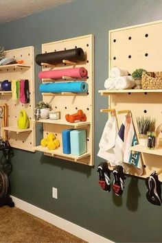 there are two shelves with yoga mats and other items on them in the room,