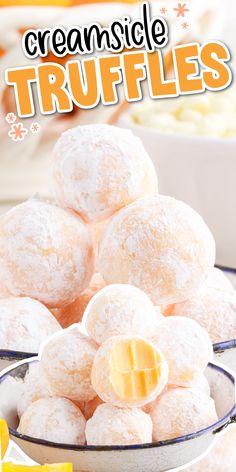 a bowl filled with powdered sugar covered cremesice truffles