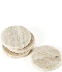 three marble coasters sitting on top of each other in front of a white background