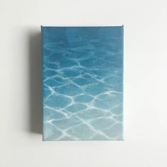 a blue book with water ripples on it