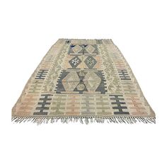 an old rug with fringes on it