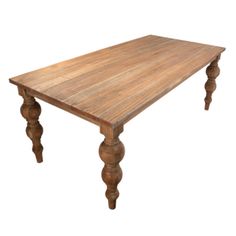 an old wooden table with turned legs on a white background is seen in this image