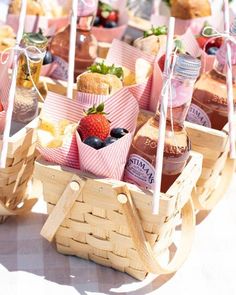 baskets filled with different types of food on top of a table