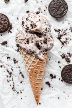 an ice cream cone with oreo cookies on the side