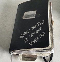 a black book with writing on it that says things i wanted to say but never did