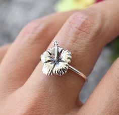 "Hibiscus Flower Ring details: -Solid .925 sterling silver -Hibiscus measures approx. 13x11mm -Smooth ring band measures 1.2mm wide -Comfortable and easily stackable! -Available in US sizes 1-11 with half sizes. *Hibiscus Stacking Ring set shown here: https://www.etsy.com/listing/832812414/hibiscus-ring-hawaiian-hibiscus-ring?ref=shop_home_active_1&frs=1 Looking for a last minute or unique Christmas gift? Visit our \"READY TO SHIP\" section here, ships out in one business day https://www.ets Hawaiian Accessories, Hawaiian Flower, Hibiscus Flower Bracelet, Hibiscus Ring, Hibiscus Flower Belly Ring, Hawaiian Rings, Hawaiian Ring, Hibiscus Jewelry, Hibiscus Flower Earrings