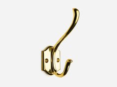 an image of a gold door handle on a white background in the shape of a hook