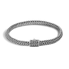 This classic chain bracelet from John Hardy is sure to become your next jewelry staple. Crafted from sterling silver, this bracelet features beautiful strands that are woven together for a rope like feel. Because of its simple design, this bracelet can be worn by itself or stacked with other pieces for an on-trend look. The bracelet measures 5mm in width and fits a wrist that measures 6 - 6.5 inches. John Hardy Style#: BB96CXM Classic Wheat Chain Link Bracelet, Elegant Braided Sterling Silver Bracelet, Classic Wheat Chain Link Bracelets, Classic Braided Bracelet With Sterling Silver Clasp For Gift, Classic Braided Bracelet With Sterling Silver Clasp, Elegant Sterling Silver Braided Bracelet, Braided Sterling Silver Bracelet, Classic Formal Braided Bracelet, Classic Sterling Silver Clasp Bangle Bracelet