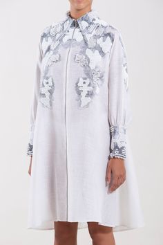 Description Off-White A-line, Short dress Loose, Long Sleeves Closed neckline Printed fabric, Beading Dry Clean Evening Dress RTWSS22-19-38 Linen Tunic Dress With Floral Embroidery, Long Sleeve Dresses With Pearl Embroidery For Summer, Long Sleeve Summer Dresses With Pearl Embroidery, Elegant White Tunic With Floral Embroidery, Elegant Spring Tunic With Embroidered Neckline, White Embroidered Dress With Pearl Details, White Linen Knee-length Dress, White Knee-length Linen Dress, Spring White Embellished Midi Dress