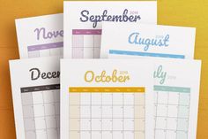 three calendars with the words november, december and october written in different colors on them