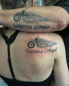 two people with tattoos on their backs hugging each other and the words daughters guardian written in black ink