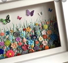 there are many flowers and butterflies on the wall in this frame, but no one is present