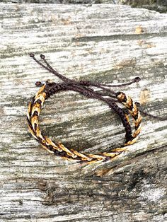 "Set of 3 stackable surfer bracelets for men in 3 tones of brown. You will receive a set of 3 macrame bracelets as pictured above. This pack includes: - 1 braid bracelet - 1 square knot bracelet - 1 fishbone bracelet Made with quality waxed cord, they are adjustable and waterproof. ☆ ☆ ☆ SIZING ☆ ☆ ☆ This bracelet set is fully adjustable. We do offer several sizes so that you are able to get the best fit: - Kid (for kids until 8-10 yo): about 7\" when fully extended (17 cm) - Standard (one size Cheap Waxed Cord Bracelets For Beach, Brown Waxed Cord Friendship Bracelet For Beach, Brown Adjustable Cord Bracelet For Beach, Green Braided Waxed Cord Bracelets For Beach, Fishbone Bracelet, Square Knot Bracelet, 1 Braid, Hand-strung Waxed Cord Beach Bracelets, Square Knot Bracelets