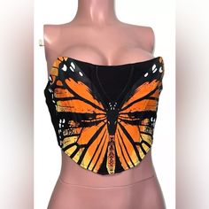 Add A Touch Of Elegance To Your Wardrobe With This Beautiful Butterfly Corset Top From Rehab. This Tube Top Comes In A Slim Fit And Features A Sweetheart Neckline With A Strapless Design, Perfect For Any Party Or Cocktail Occasion. The Top Has A Zip Closure And Is Made From A Stretchy Polyester-Spandex Material, Ensuring A Comfortable Fit. The Top Is Accented With A Butterfly Pattern, As Well As Strapless And Zipper Accents. It Is Cropped In Style And Ideal For The Summer And Spring Seasons. Summer Black Corset For Cosplay, Black Corset For Summer Cosplay, Summer Cosplay Black Corset, Halloween Festival Corset, Butterfly Corset Top, Butterfly Corset, Festival Fairy, Fairy Festival, Slouchy Sweatshirt