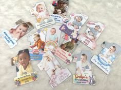 a bunch of baby's and children's photo magnets are laying on the floor