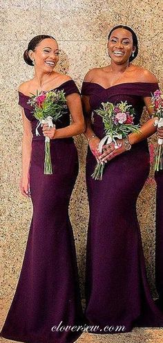 three women standing next to each other wearing purple dresses and holding bouquets in their hands