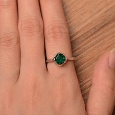 It is a lab emerald ring, round cut, measures 7mm*7mm, weight about 1.3 cts. The basic metal is sterling silver and plated with rhodium. To change the metal to a solid gold (white/rose) or platinum is also available, please ask for a quotation if you want. You can also go to my shop Home for more elegant rings: https://www.etsy.com/shop/godjewelry?ref=hdr_shop_menu emerald is May birthstone More emerald rings: https://www.etsy.com/shop/godjewelry?ref=seller-platform-mcnav&section_id=20709240 Emerald Solitaire Promise Ring, Sterling Silver Round Birthstone Ring For May, Emerald Solitaire Birthstone Ring In Fine Jewelry Style, Sterling Silver Emerald Ring With Bezel Setting, Fine Jewelry Emerald Solitaire Birthstone Ring, Sterling Silver Brilliant Cut Rings For May Birthstone, Emerald Solitaire Birthstone Ring, Sterling Silver Rings With Brilliant Cut For May Birthstone, Emerald Solitaire Birthstone Ring With Round Band