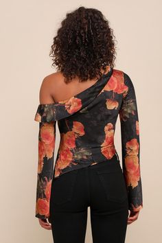 A naturally elegant babe like you was made for the Lulus Born Chic Black Floral Print Satin Off-the-Shoulder Top! Sleek woven satin, with a dreamy floral print, shapes an off-the-shoulder neckline with a chic fold-over detail, framed by long sleeves with flared cuffs. The blousy, darted bodice falls to a slightly asymmetrical hem. Hidden side zipper/clasp. Fit: This garment fits true to size. Length: Size medium measures 19.5" from shoulder to hem. Bust: Great for any cup size. Waist: Loosely Fi Spring Satin Top With Asymmetrical Neckline, Spring Satin Tops With Floral Print, Spring Satin Floral Print Tops, Spring Floral Print Satin Top, Fitted One Shoulder Floral Print Tops, Fitted One-shoulder Floral Print Tops, Off-shoulder Floral Print Party Tops, Elegant Off-shoulder Floral Print Tops, Satin Long Sleeve Top