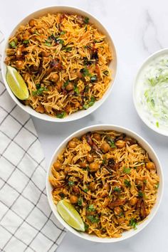 three bowls filled with rice and vegetables on top of a white table cloth next to a bowl of sour cream