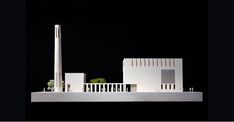 an architectural model of a building with white walls and balconies on the roof