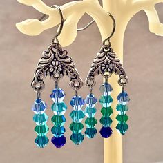 Blue Ombré dangle earrings with gorgeous sparkling multifaceted crystals. These original designed earrings are lovingly handmade with tiny glass crystal beads in light catching rows.  Attached to a lovely flower embossed Tibetan silver component and hypoallergenic stainless steel hooks. Drops measure 3 centimeters long. 🌟 Now available in an assortment of colors! See options at checkout. 🌸 These sparkling ✨ pretties arrive gift boxed  ❤️ 🌟 Beach Waterfall, Waterfall Earrings, Earrings Chandelier, Earrings Blue, Blue Ombre, Chandelier Earrings, Crystal Earrings, Crystal Beads, Beaded Earrings