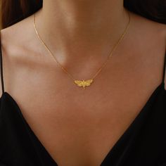 "Enter the enchanting world of the nocturnal with our Moth Necklace for the holiday season. This piece isn't just a necklace; it's a tribute to the mysterious and delicate beauty of moths, making it a sought-after item in the realm of Moth Jewelry. The intricate details on the Moth Wings Necklace capture the essence of moonlit nights and the quiet flutter of wings, ensuring you're not just wearing a piece of jewelry, but a captivating story. Immerse yourself in a world of gothic allure and let your style soar this holiday season. PRODUCT DETAILS: * Choose of Material: 925 Sterling Silver, 14K Solid Gold (real solid gold, no gold-filled or no gold plated material) * Choice of Gold Color: Yellow Gold, Rose Gold, White Gold * Closure: Spring ring * Chain style: Cable * Style: Minimalist M O R Insect Jewelry Gold, Location Names, Insects Jewelry, Moth Jewelry, Christmas Gift Her, Moth Pendant, Dangle Cross Earrings, Moth Necklace, Insect Necklace