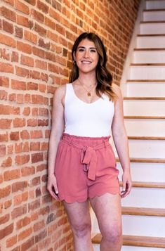 This bodysuit should be a staple in everyone’s wardrobe! Ribbed knit with wide straps, front V neck, scoop back, and thong bottom is the perfect basic stretchy bodysuit to mix and match with any skirt, shorts, pants, or jeans imaginable. Material: 92% NYLON 8% SPANDEX Size: OS one size Trendy High-waisted Shorts With Tie Waist, Spring High-waisted Tie Waist Shorts, Chic Spring Shorts With Tie Waist, Chic Paperbag Waist Shorts With Tie, Chic Shorts With Elastic Waistband For Brunch, Feminine Short Length Bottoms For Brunch, Summer High Waist Tie Waist Shorts, Feminine Shorts With Elastic Waistband, Trendy Shorts With Tie Waist For Day Out