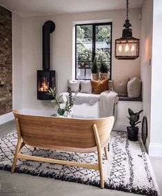 a living room filled with furniture and a fire place on top of a wooden table