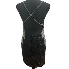 Nwt Enchanted Black & Silver Sequin/Beaded Adjustable Chain Straps Backless Short Dress Size 6. Price Tag Is Gone But Extra Sequins Are Still Attached (See Pictures) Never Worn. The Straps In The Back Can Be Adjusted. There Is A Zipper In The Back Of The Skirt Area Glamorous Mini Dress With Beaded Straps For Night Out, Cocktail Sequin Dress With Beaded Straps For Party Season, Glamorous Mini Dress With Beaded Straps For Evening, Glamorous Evening Mini Dress With Beaded Straps, Elegant Sequin Dress With Beaded Straps For Night Out, Glamorous Formal Mini Dress With Beaded Straps, Glamorous Gala Dresses With Chain Strap, Glamorous Sequin Dress With Beaded Straps For Night Out, Beaded Straps Backless Mini Dress For Night Out