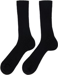 Pair of calf-high rib knit cashmere socks in black. Supplier color: Black Classic Cashmere Socks For Winter, Black Business Socks For Winter, Classic Fall Cashmere Socks, Classic Black Knee-high Socks, Black Formal Winter Socks, Formal Black Winter Socks, Black Ribbed Knee-high Socks For Winter, Classic Black Socks For Fall, Fitted Black Ribbed Socks