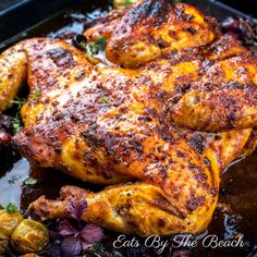 grilled chicken with herbs and spices in a pan